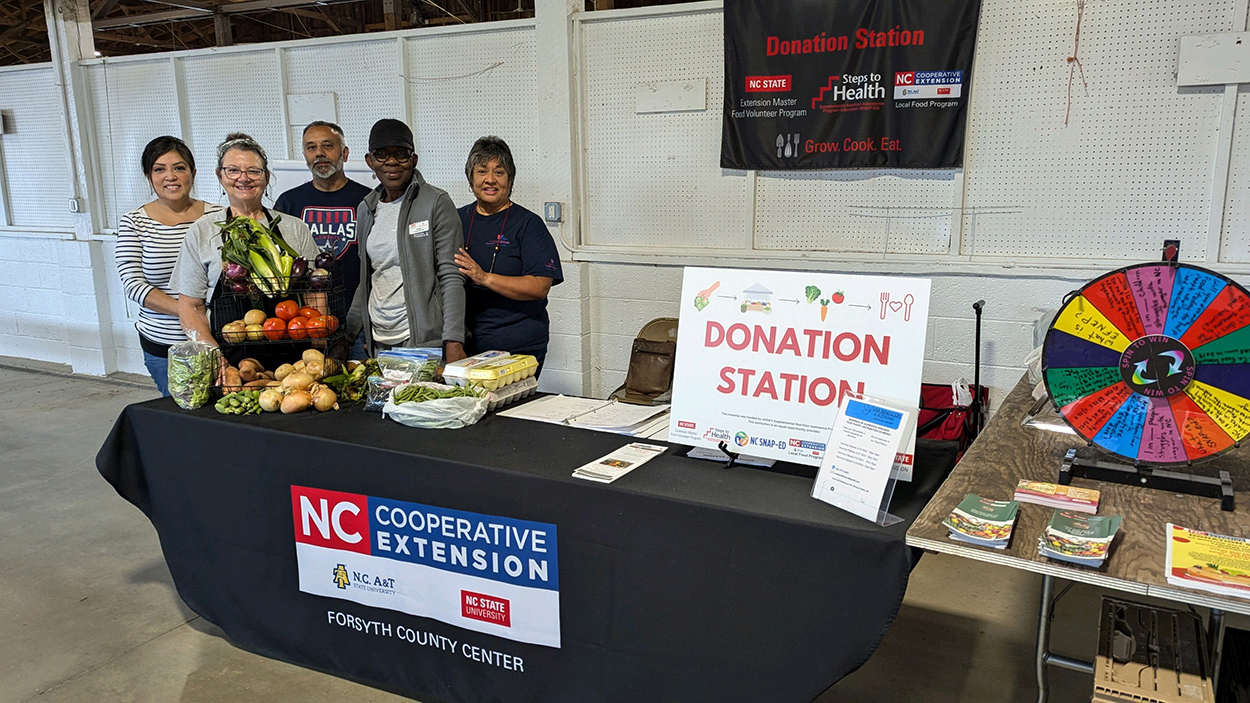 Cooperative Extension staff at the Donation Station at the Winston-Salem Fairgrounds Farmers Market